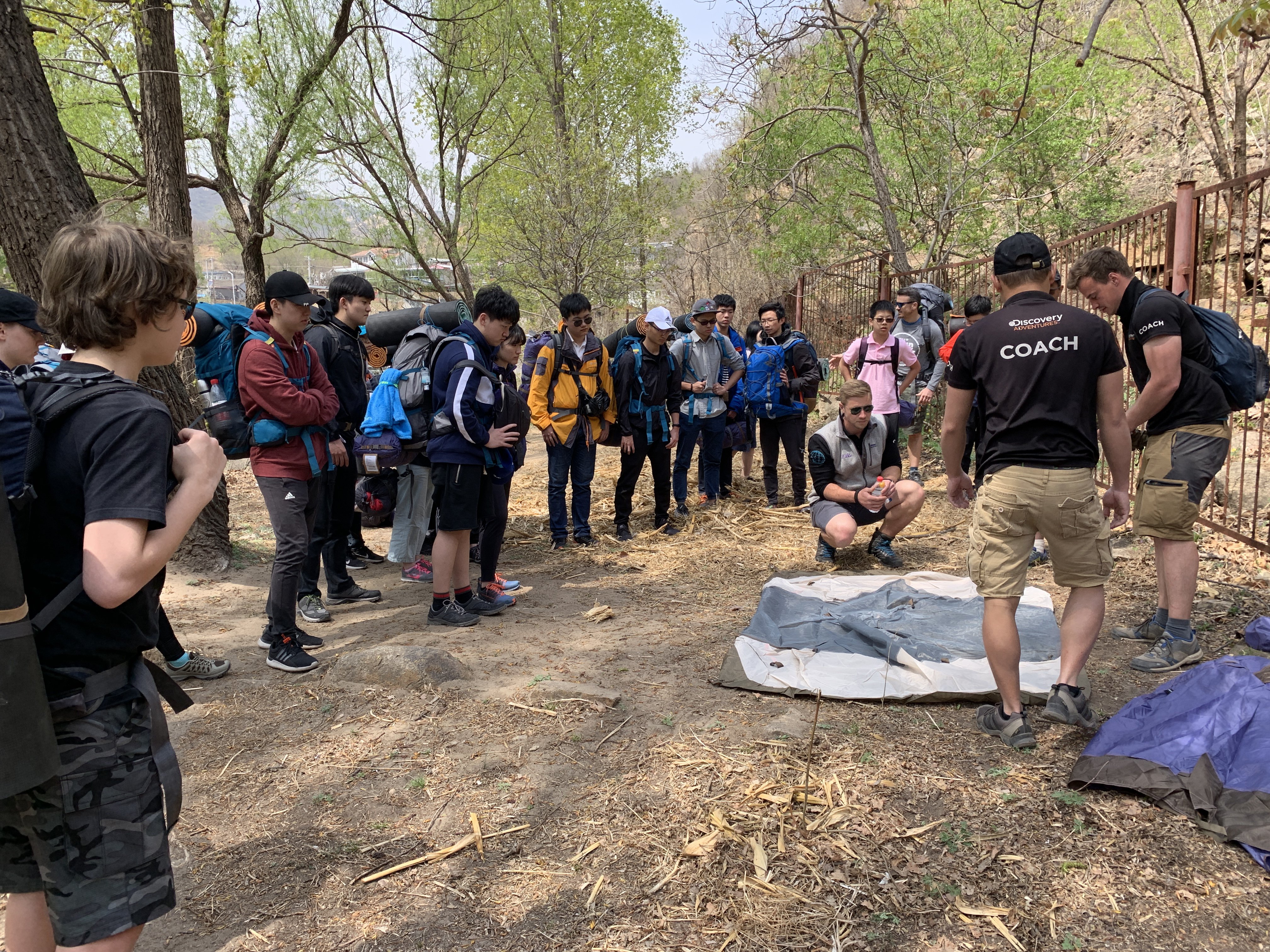 Students being shown how to set up camp